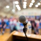 Close up of microphone on a podium in an auditorium